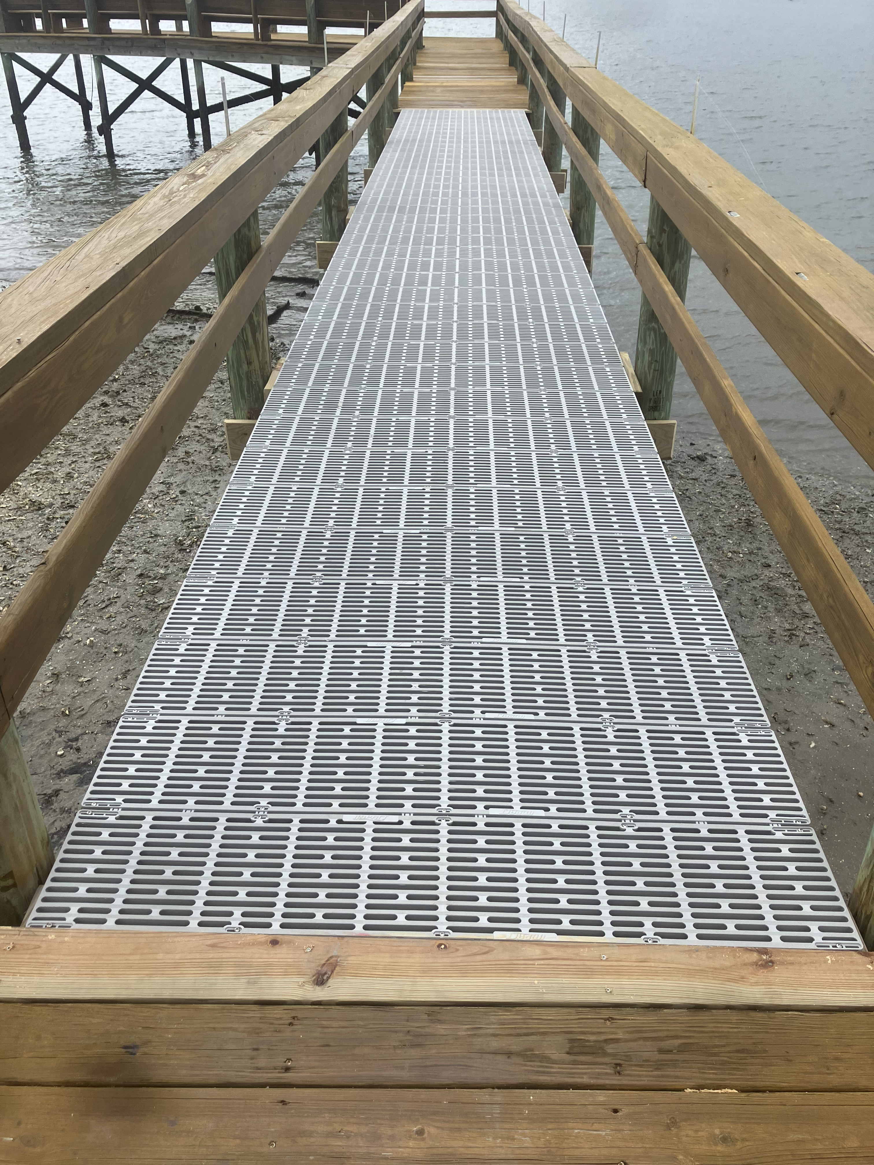 New dock walkway with quality grating and fresh-cut pressure-treated framing